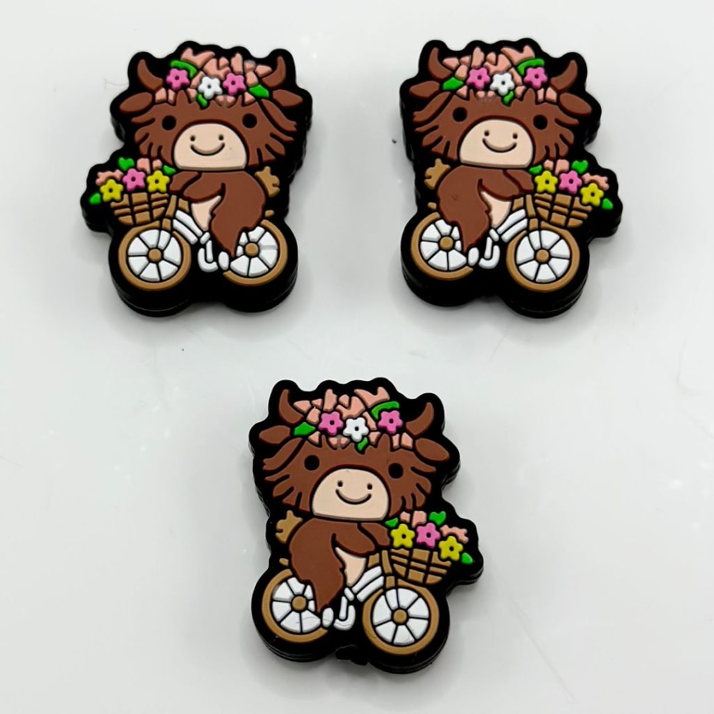 Little Cute Brown Cow Rides a Bike with Small Flowers Silicone Focal Beads